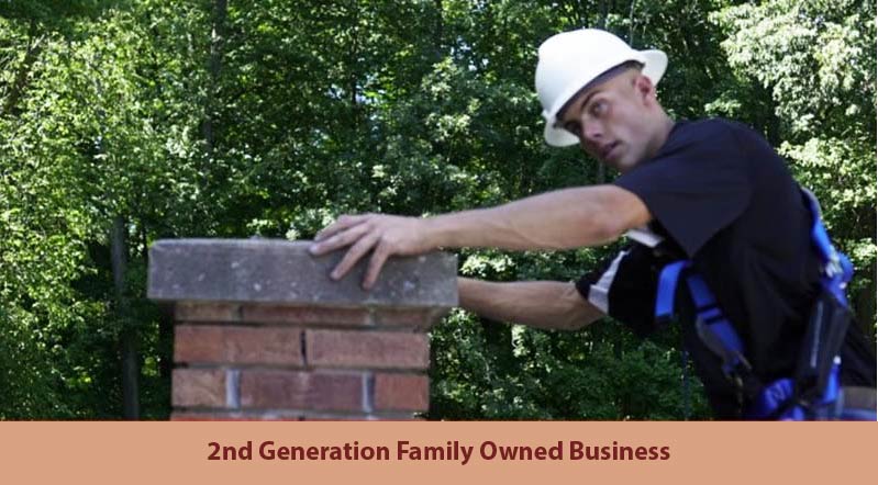 Original photo of 2nd generation working - Legendary Chimney Solutions Owner's son wearing a hard hat and harness while inspecting a red brick chimney. Image reads "2nd Generation Family Owned Business"
