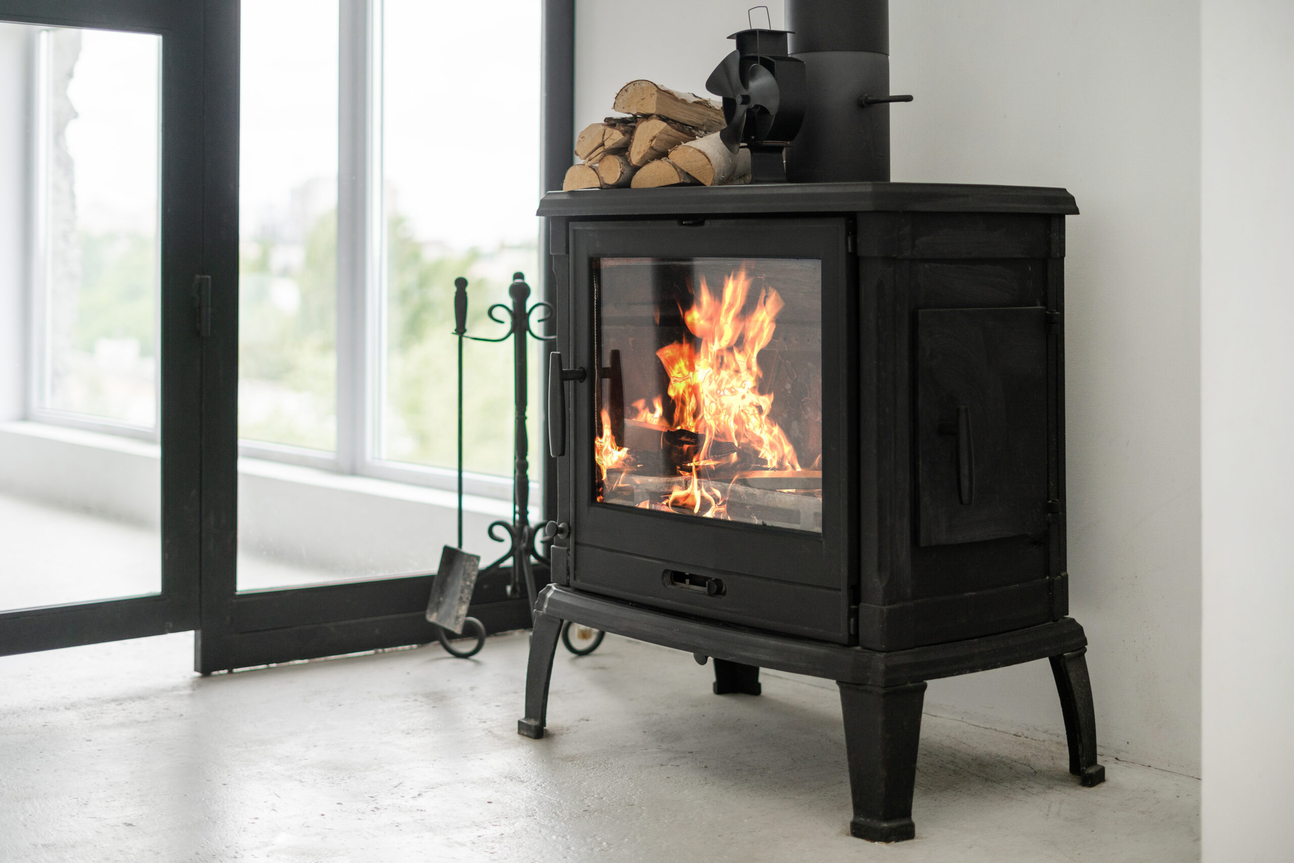 Adobe stock image of a wood home heating stove.